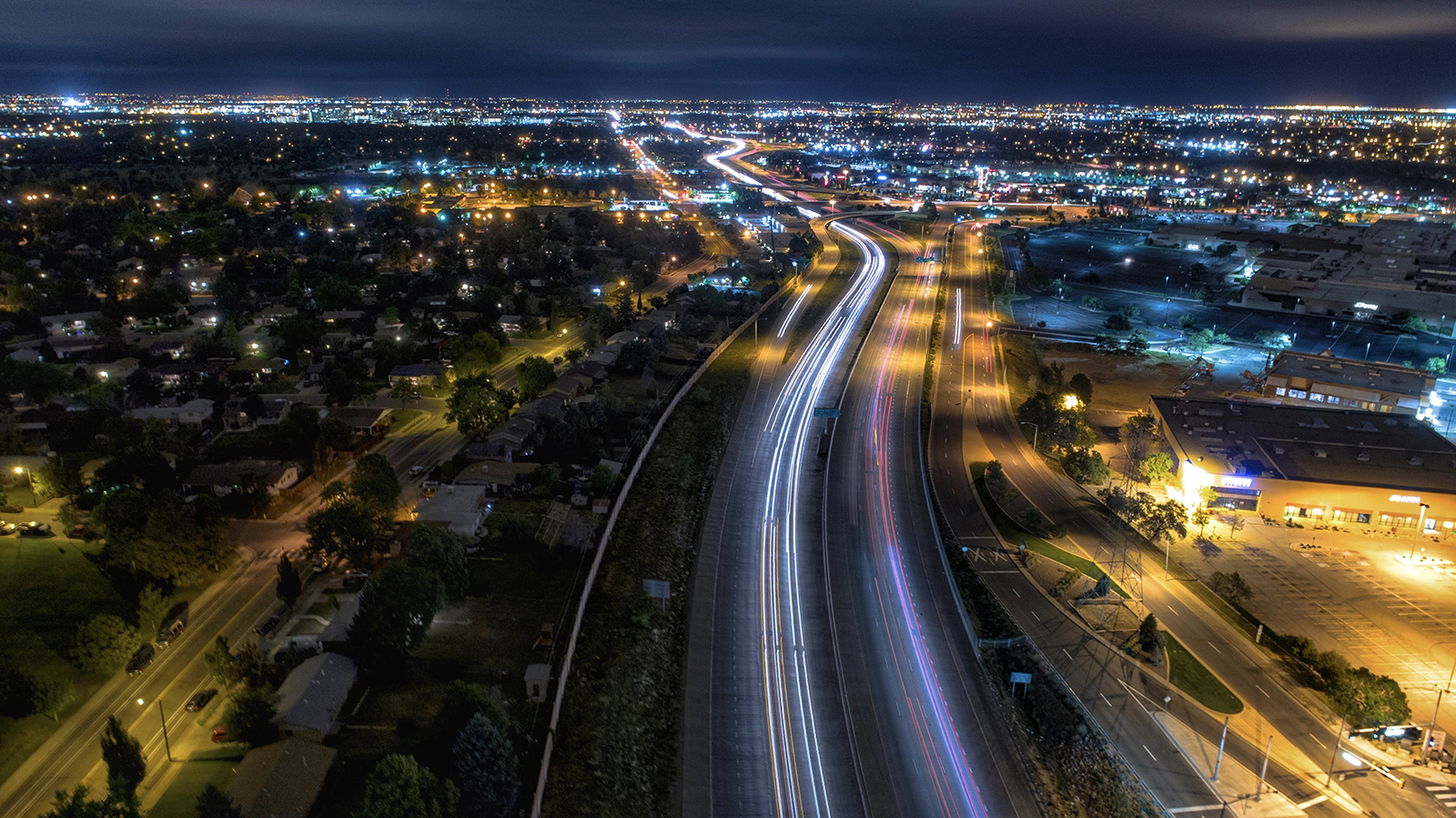 At night, cars use a major road in the Denver suburb of Aurora, Colorado.